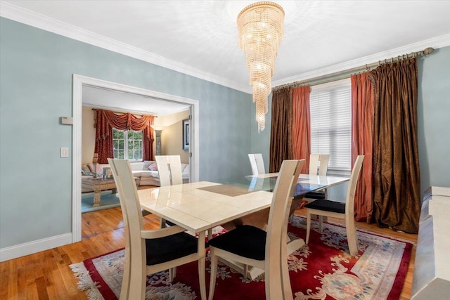 2 Apple Ct, Eastchester, NY 10709 - dining room with wood finished floors, crown molding, and a chandelier