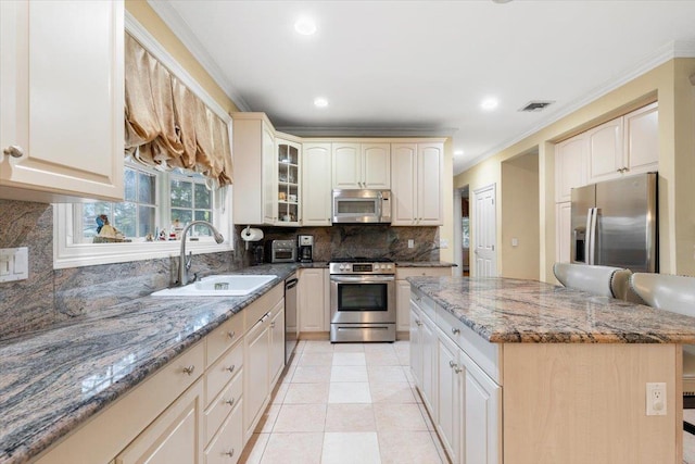 2 Apple Ct, Eastchester, NY 10709 - kitchen with stainless steel appliances, dark stone countertops, a center island, decorative backsplash, and recessed lighting