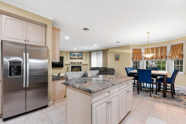 2 Apple Ct, Eastchester, NY 10709 - kitchen with stainless steel fridge with ice dispenser, light tile patterned floors, a center island, recessed lighting, and stone countertops