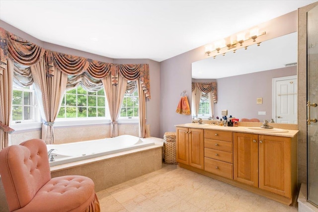 2 Apple Ct, Eastchester, NY 10709 - bathroom with plenty of natural light, a garden tub, double vanity, and a shower stall