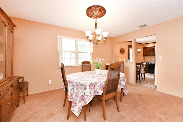 7 Albergo Ln, Syosset, NY 11791 - dining room with a chandelier and light carpet