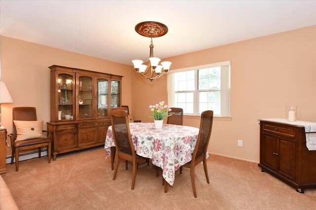 7 Albergo Ln, Syosset, NY 11791 - dining room with a chandelier, a baseboard radiator, and light colored carpet