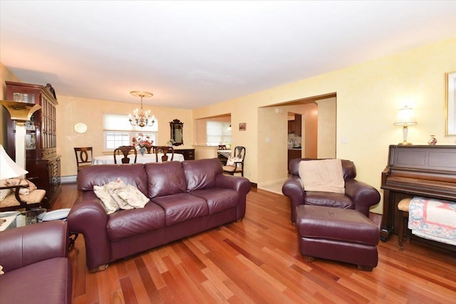 7 Albergo Ln, Syosset, NY 11791 - living room with a chandelier and wood finished floors