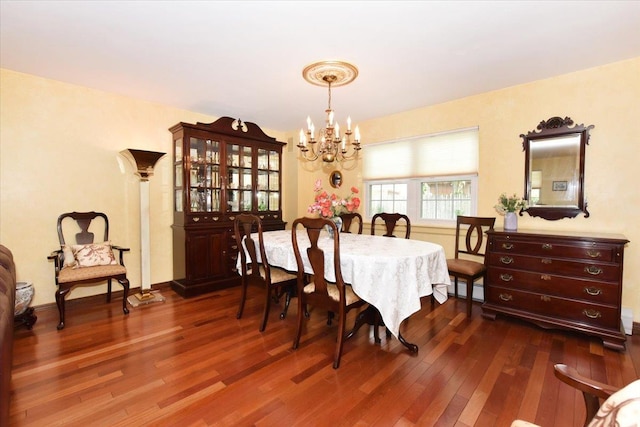 7 Albergo Ln, Syosset, NY 11791 - dining area featuring a chandelier, dark wood-style flooring, and a baseboard radiator