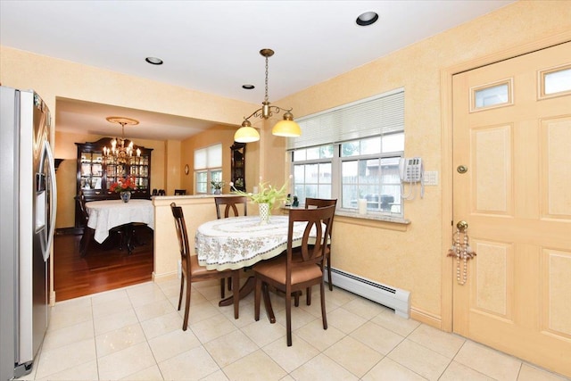 7 Albergo Ln, Syosset, NY 11791 - dining space featuring baseboard heating, a chandelier, and light tile patterned floors