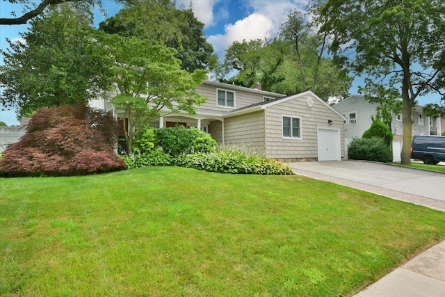 7 Albergo Ln, Syosset, NY 11791 - view of front of house with a front yard, concrete driveway, a chimney, and a garage