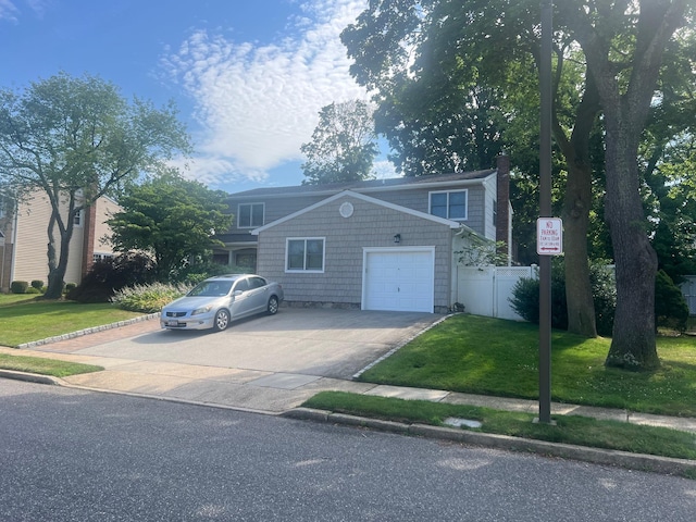 7 Albergo Ln, Syosset, NY 11791 - view of front of house with concrete driveway and a garage