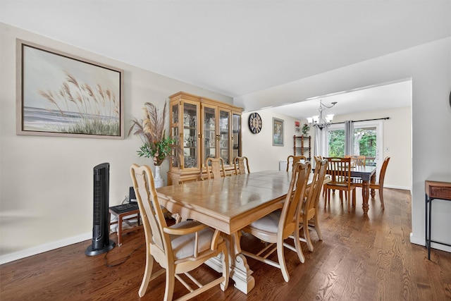 418 Pawnee Ct, Suffern, NY 10901 - dining area with dark wood-style flooring and a chandelier