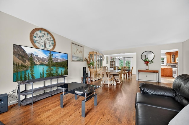 418 Pawnee Ct, Suffern, NY 10901 - living area featuring light wood finished floors and a chandelier