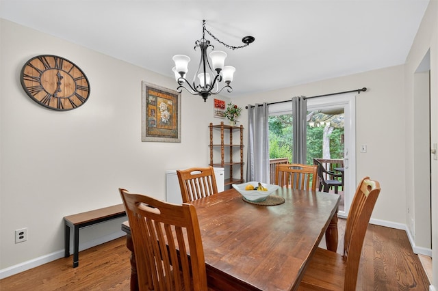 418 Pawnee Ct, Suffern, NY 10901 - dining room with wood finished floors and a chandelier