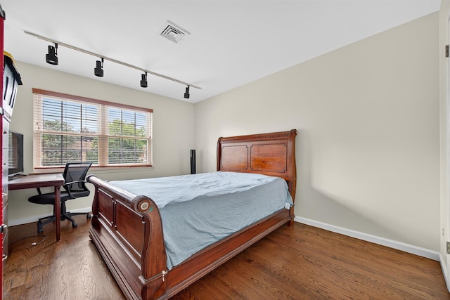 418 Pawnee Ct, Suffern, NY 10901 - bedroom with wood finished floors, track lighting, and an office area