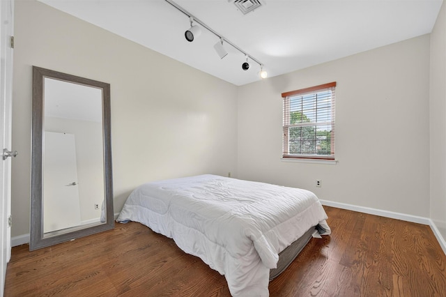 418 Pawnee Ct, Suffern, NY 10901 - bedroom with rail lighting and wood finished floors