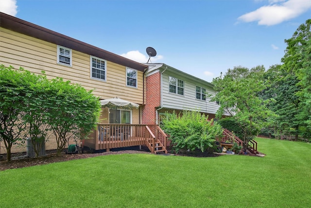418 Pawnee Ct, Suffern, NY 10901 - rear view of property featuring a wooden deck, a lawn, and brick siding