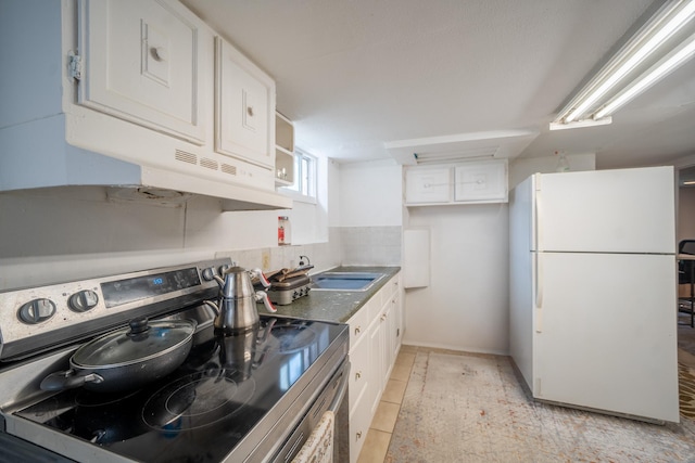 47 Cardinal Rd, Levittown, NY 11756 - kitchen featuring freestanding refrigerator, stainless steel range with electric cooktop, white cabinets, and open shelves