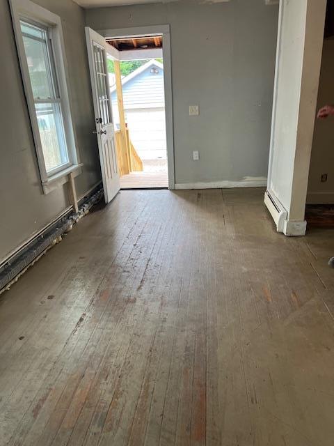 47 Gifford Ave, Poughkeepsie, NY 12601 - unfurnished living room with hardwood / wood-style floors and baseboards