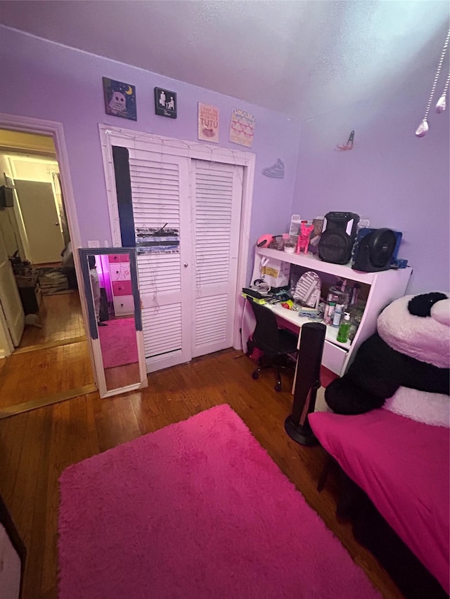 21543 48th Ave Unit 1E, Bayside, NY 11364 - bedroom featuring wood finished floors and a closet