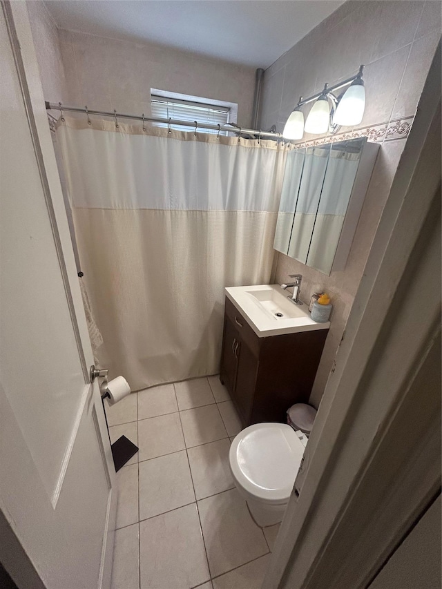 21543 48th Ave Unit 1E, Bayside, NY 11364 - full bath with vanity, tile patterned floors, and curtained shower