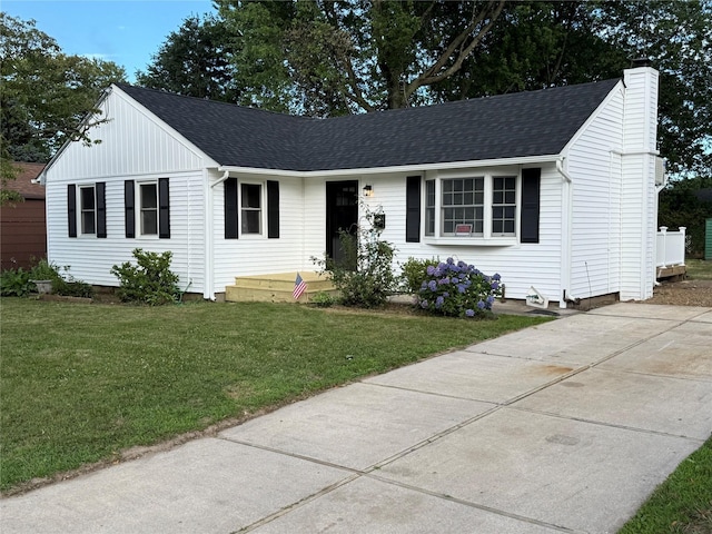 22 Bradish Ln, Babylon, NY 11702 - ranch-style house with a chimney, a front yard, and roof with shingles