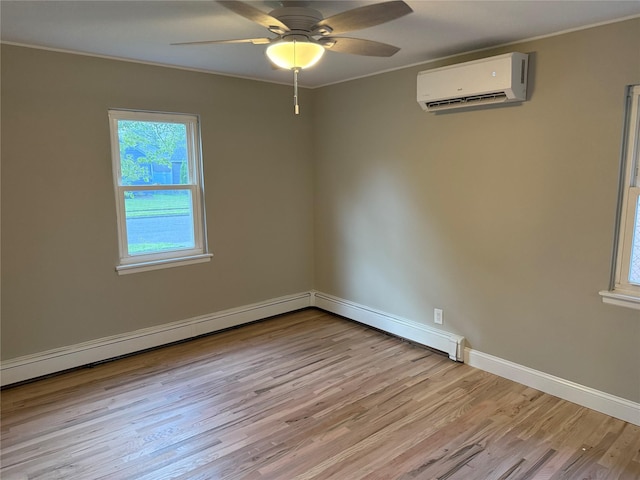 22 Bradish Ln, Babylon, NY 11702 - spare room with a wall mounted air conditioner, light wood-type flooring, ornamental molding, ceiling fan, and a baseboard radiator