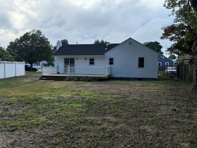 22 Bradish Ln, Babylon, NY 11702 - back of house featuring a chimney and a wooden deck