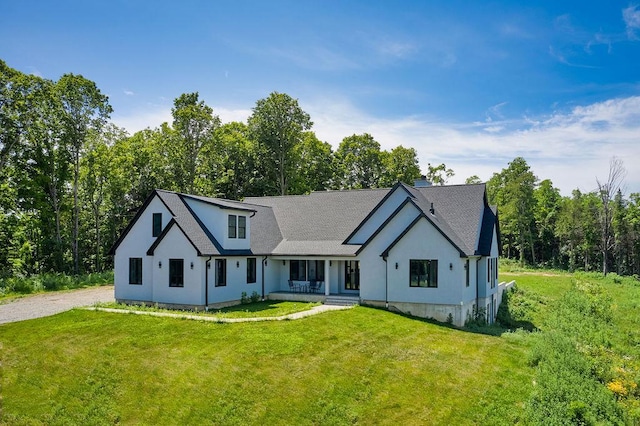 75 Red Fox Ln, Salt Point, NY 12578 - modern farmhouse style home with a front yard, covered porch, and stucco siding