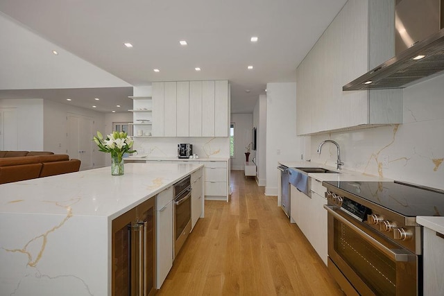 75 Red Fox Ln, Salt Point, NY 12578 - kitchen with wall chimney range hood, stainless steel appliances, modern cabinets, recessed lighting, and backsplash