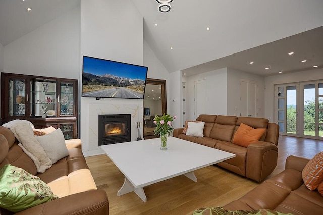75 Red Fox Ln, Salt Point, NY 12578 - living room with light wood-style flooring, high vaulted ceiling, a high end fireplace, and recessed lighting