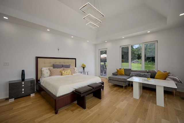 75 Red Fox Ln, Salt Point, NY 12578 - bedroom with recessed lighting, light wood-style floors, a chandelier, and a tray ceiling
