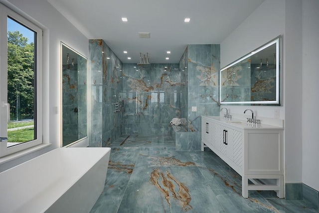 75 Red Fox Ln, Salt Point, NY 12578 - bathroom featuring plenty of natural light, a marble finish shower, double vanity, recessed lighting, and a freestanding tub