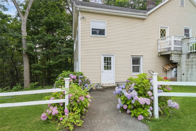 126 Tanglewylde Rd, Lake Peekskill, NY 10537 - view of front facade featuring a chimney and a shingled roof