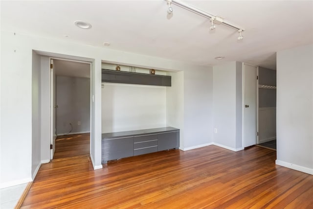 126 Tanglewylde Rd, Lake Peekskill, NY 10537 - spare room with wood finished floors and rail lighting