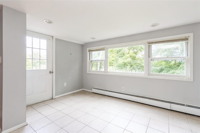 126 Tanglewylde Rd, Lake Peekskill, NY 10537 - empty room featuring a baseboard heating unit, plenty of natural light, recessed lighting, and light tile patterned flooring