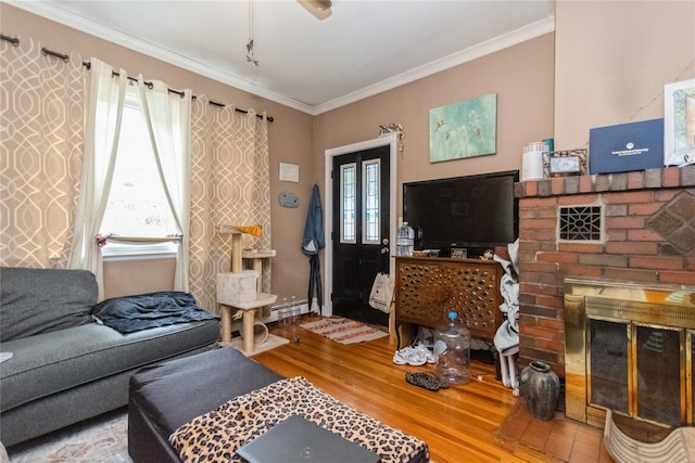 126 Tanglewylde Rd, Lake Peekskill, NY 10537 - living area with wood finished floors, crown molding, a fireplace, and baseboard heating