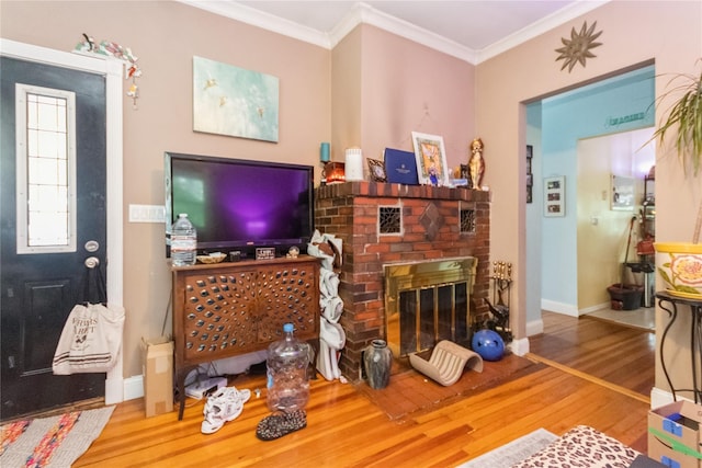 126 Tanglewylde Rd, Lake Peekskill, NY 10537 - living area with wood finished floors, ornamental molding, and a brick fireplace