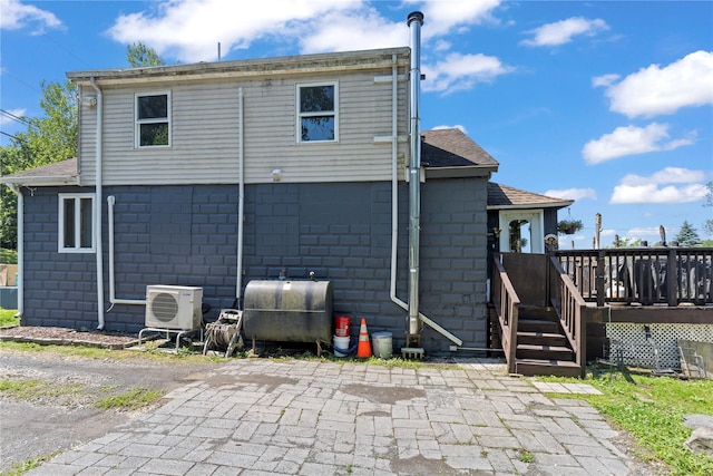 578 S St, Plattekill, NY 12528 - back of property featuring oil tank, a deck, concrete block siding, and a shingled roof