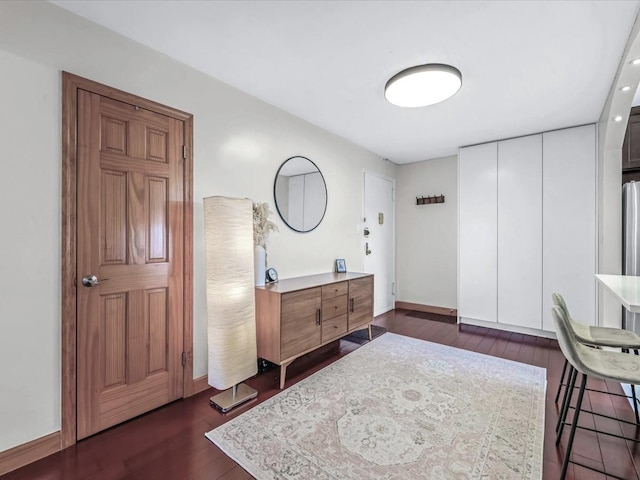 29-49 137th St Unit 6G, Flushing, NY 11354 - bedroom with dark wood-type flooring, freestanding refrigerator, and a closet