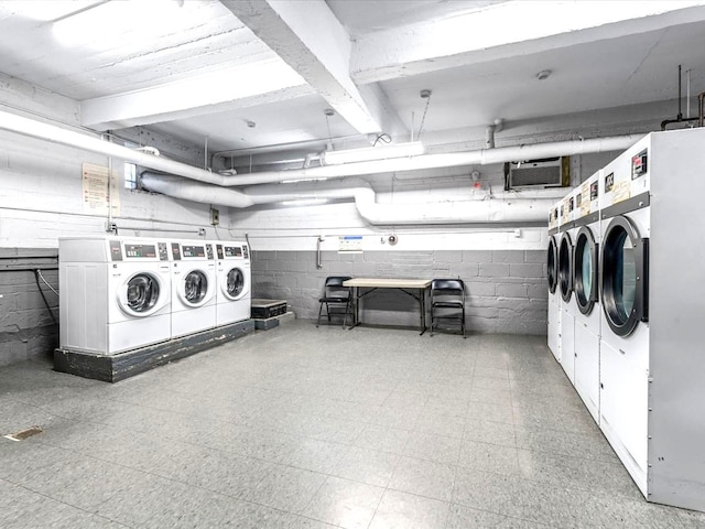 29-49 137th St Unit 6G, Flushing, NY 11354 - shared laundry with washer and clothes dryer and concrete block wall