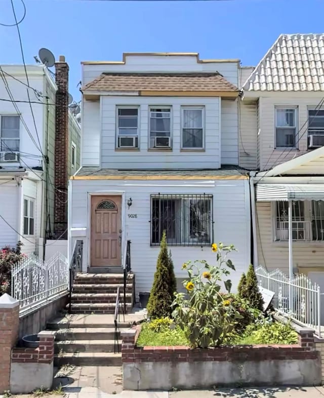 90-28 78th St, Woodhaven, NY 11421 - view of property featuring entry steps and roof with shingles