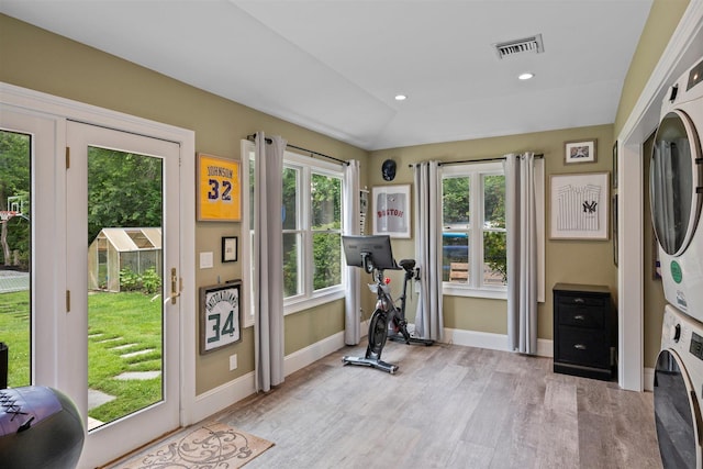 24 Canvasback Ln, East Quogue, NY 11942 - workout area with estacked washer and dryer, light wood-style floors, and recessed lighting