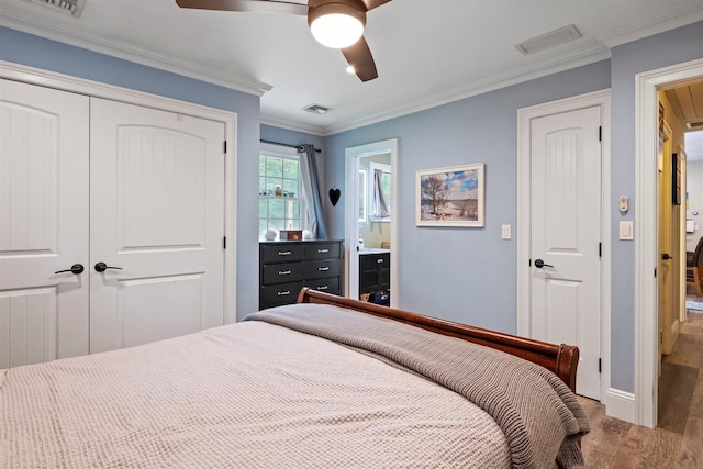 24 Canvasback Ln, East Quogue, NY 11942 - bedroom with a closet, wood finished floors, crown molding, a ceiling fan, and connected bathroom