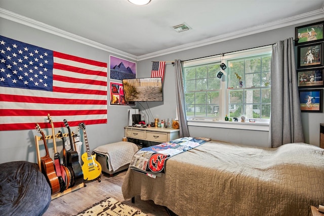24 Canvasback Ln, East Quogue, NY 11942 - bedroom featuring wood finished floors and ornamental molding