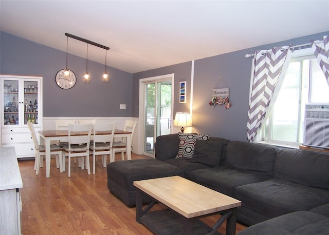 5 Windham Ln, Ronkonkoma, NY 11779 - living area featuring lofted ceiling, a wainscoted wall, and wood finished floors