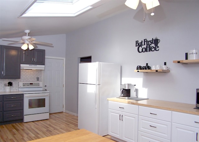 5 Windham Ln, Ronkonkoma, NY 11779 - kitchen featuring white appliances, under cabinet range hood, ceiling fan, tasteful backsplash, and vaulted ceiling