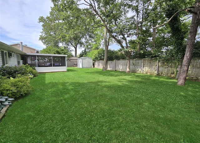 5 Windham Ln, Ronkonkoma, NY 11779 - fenced backyard featuring a sunroom and a storage unit