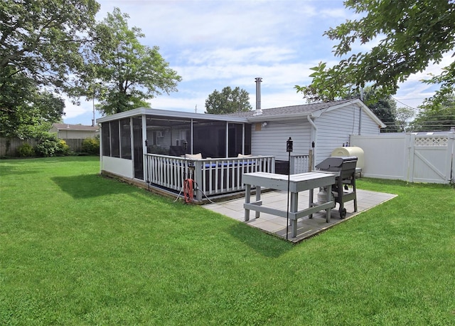 5 Windham Ln, Ronkonkoma, NY 11779 - back of property with a sunroom, a gate, a fenced backyard, and roof with shingles