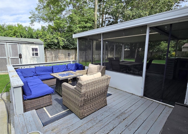 5 Windham Ln, Ronkonkoma, NY 11779 - wooden deck with a sunroom, an outdoor living space with a fire pit, and a shed