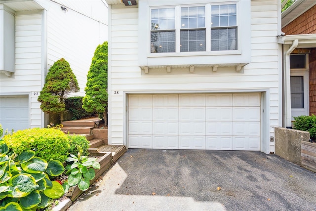 28 The Mews, Syosset, NY 11791 - garage featuring asphalt driveway