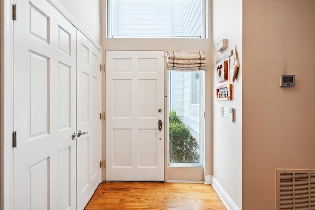 28 The Mews, Syosset, NY 11791 - entryway featuring light wood-type flooring and baseboards