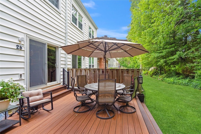 28 The Mews, Syosset, NY 11791 - wooden deck with outdoor dining area and a lawn