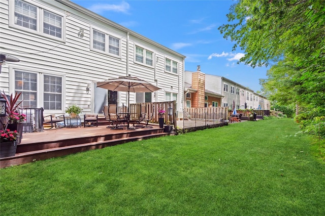 28 The Mews, Syosset, NY 11791 - back of property with a lawn and a deck